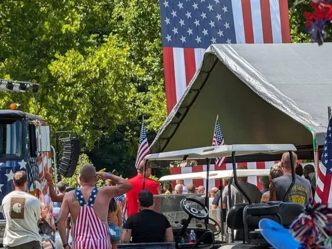 A large custom decorated rig on display with a crowd gathered around it