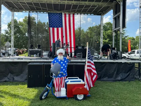 The main stage set up with the giant American flag backdrop, ready for the evening's live music